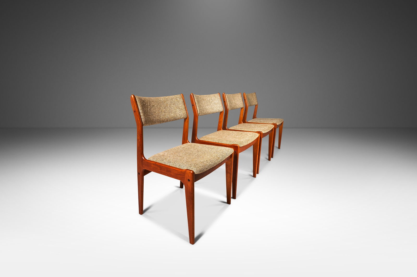 Set of Four (4) Danish Mid-Century Modern Dining Chairs in Solid Teak & Original Fabric c. 1970's: Set of Four (4) Danish Mid-Century Modern Dining Chairs in Solid Teak & Original Fabric c. 1970's This set of four Danish Mid-Century Modern dining chairs, crafted in solid Burmese teak, is a stunning