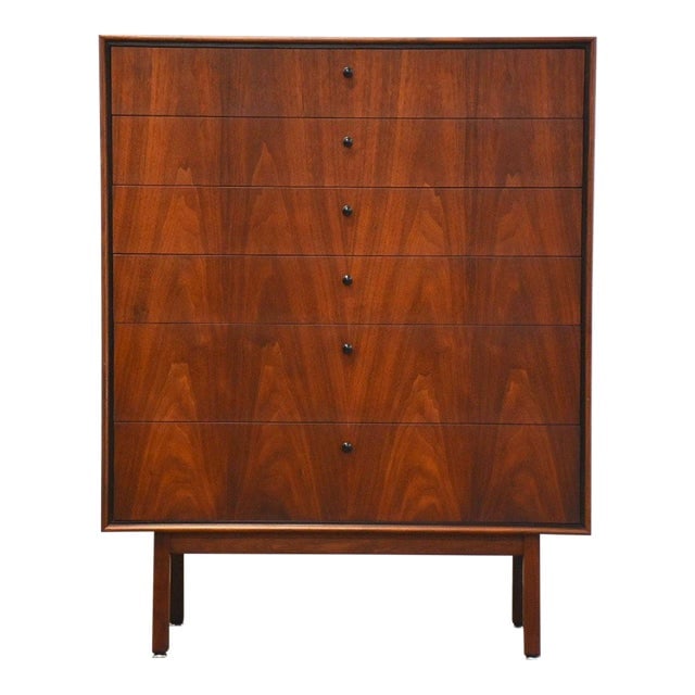 Mid Century Modern Walnut Tall Dresser with Black Accents: Mid Century Modern Walnut Tall Dresser with Black Accents This stunning mid-century modern tall dresser, designed by Jack Cartwright for Founders, features a rich walnut finish complemented by sleek b