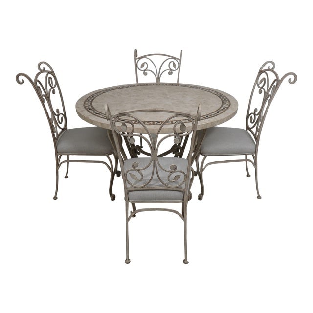 Iron & Stone Round Table & Chairs Dining Set: Iron & Stone Round Table & Chairs Dining Set This vintage dining set features a round table with a decorative stone and tile overlay top, supported by elegant scrolled iron legs. Accompanying the tabl