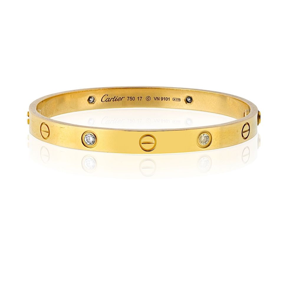 Cartier Love Bracelet 18K Yellow Gold Size 17 4 Diamonds: Cartier Love Bracelet 18K Yellow Gold Size 17 4 Diamonds This pre-owned Cartier Love Bracelet in 18k Yellow Gold (Size 17) is a luxurious and iconic piece featuring four dazzling diamonds. A symbol of