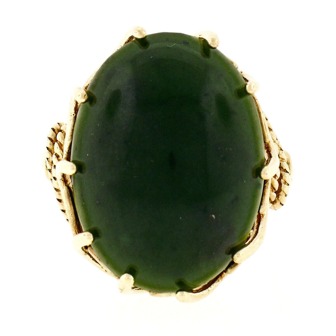 Vintage 10K Yellow Gold Large Oval Dark Green Jade Ring Size 8: Vintage 10K Yellow Gold Large Oval Dark Green Jade Ring Size 8 This vintage ring is crafted from solid 10K yellow gold and features a stunning large oval jade gemstone in a dark green hue. The elegant