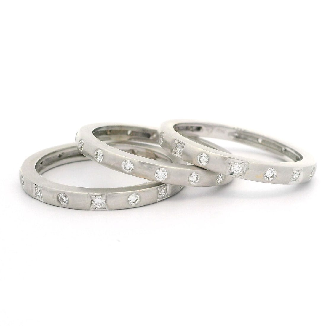 18k White Gold 1ctw Diamond Matte Finish Set of 3 Stack Band Rings: 18k White Gold 1ctw Diamond Matte Finish Set of 3 Stack Band Rings This exquisite set of three stack band rings features a stunning matte finish and is crafted from 18k white gold. Each ring is adorne