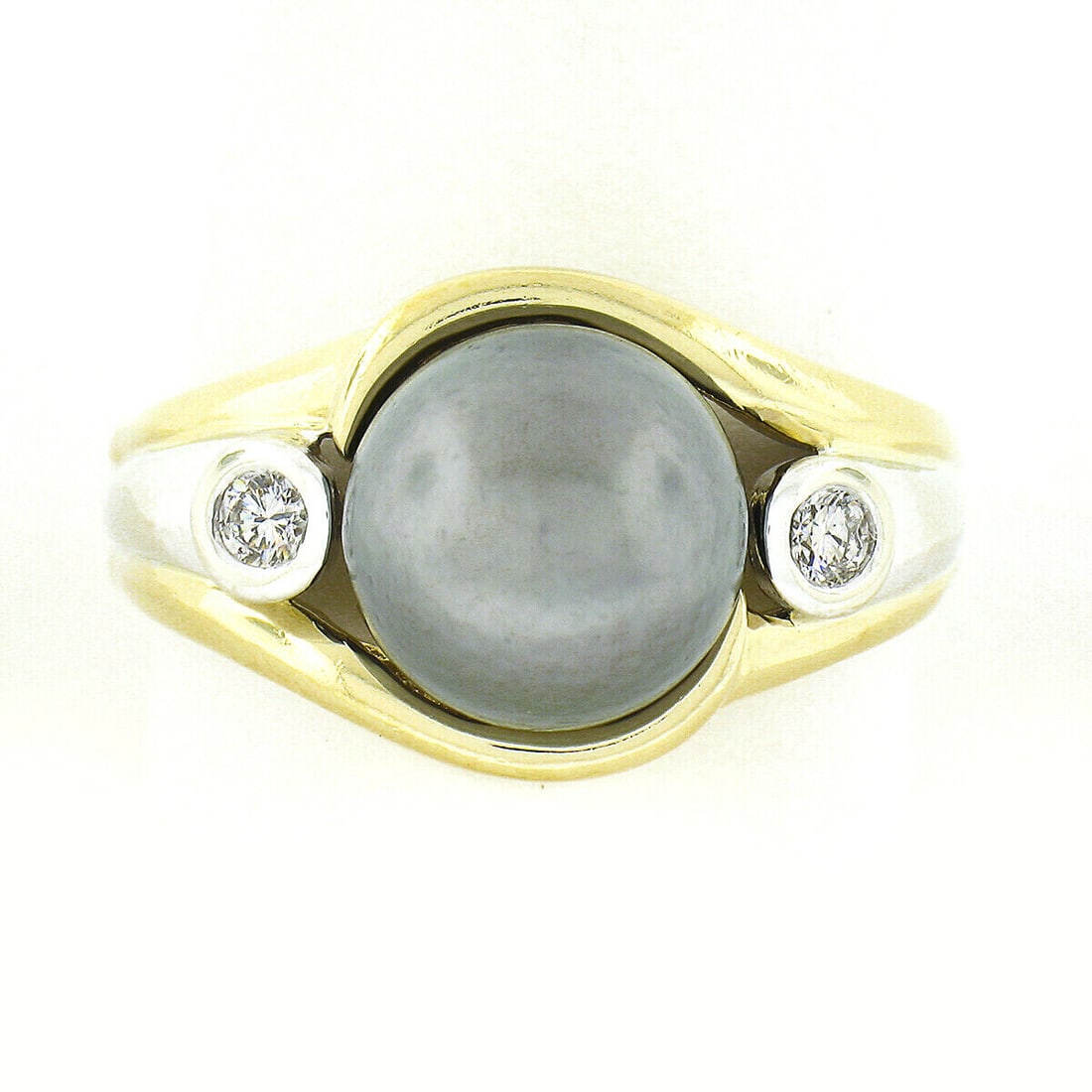 14K Multi-Tone Gold 10.1mm Dark Gray Tahitian Pearl Solitaire w/ 0.18ctw Bezel Diamond 3 Stone Ring: 14K Multi-Tone Gold 10.1mm Dark Gray Tahitian Pearl Solitaire w/ 0.18ctw Bezel Diamond 3 Stone Ring This elegant 14K two-tone gold ring features a stunning 10.1mm dark gray Tahitian pearl at its cente