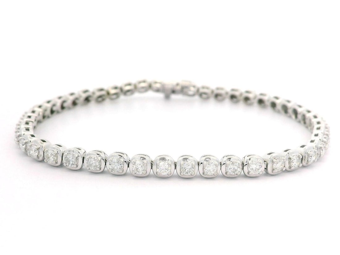 Classic 14k White Gold 1.8ctw Diamond Tennis Bracelet: Classic 14k White Gold 1.8ctw Diamond Tennis Bracelet This classic tennis bracelet features a stunning arrangement of (45) natural genuine diamonds, expertly crafted in solid 14k white gold. The round