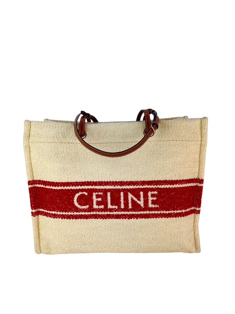 Celine Plein Soleil Cabas Canvas White Tote: Celine Plein Soleil Cabas Canvas White Tote This Celine Plein Soleil Cabas Canvas Tote is a stylish and versatile accessory, perfect for beach outings or casual days. The tote features a striking whit