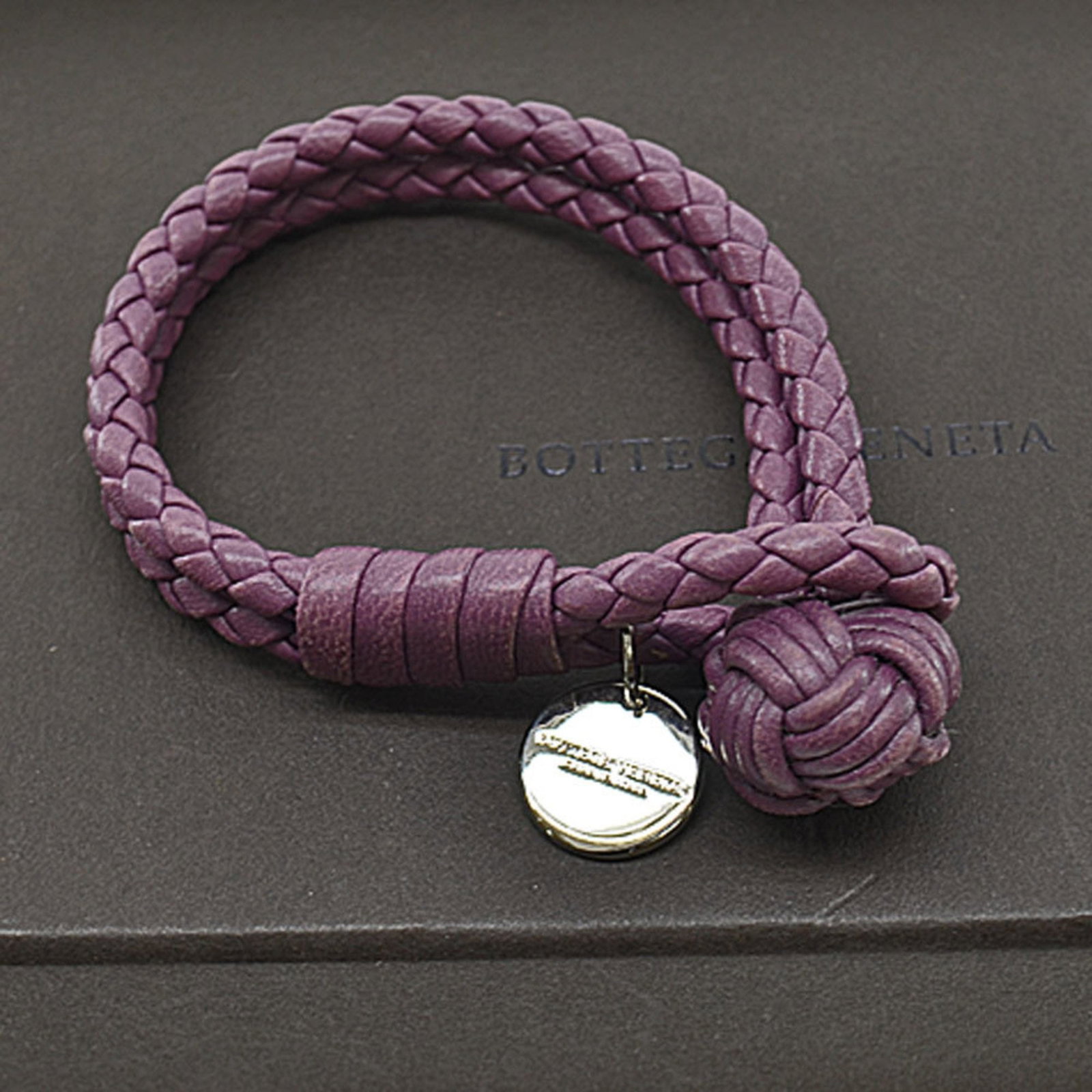 Charm Bracelet Light Purple Leather Bottega Veneta: Charm Bracelet Light Purple Leather Bottega Veneta This elegant charm bracelet from Bottega Veneta showcases a stunning light purple braided leather design complemented by a stylish silver charm. Perf