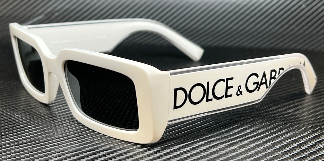 DG6187 331287 White Grey Women's Sunglasses: DG6187 331287 White Grey Women's Sunglasses Enhance your style with these stunning Dolce & Gabbana DG6187 sunglasses. Featuring a chic white rectangular frame, these sunglasses are designed to provide