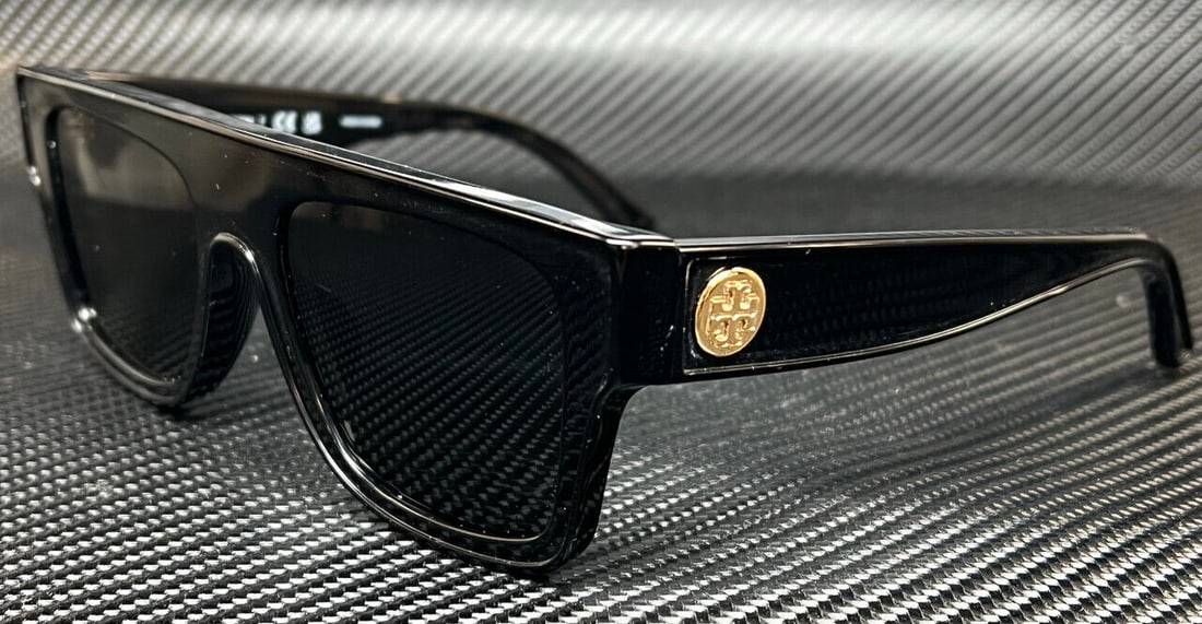 Tory Burch Black Women's Sunglasses: Tory Burch Black Women's Sunglasses Elevate your style with these chic Tory Burch sunglasses. Featuring a sleek black frame accented with a gold emblem on the side, these sunglasses are designed to pr