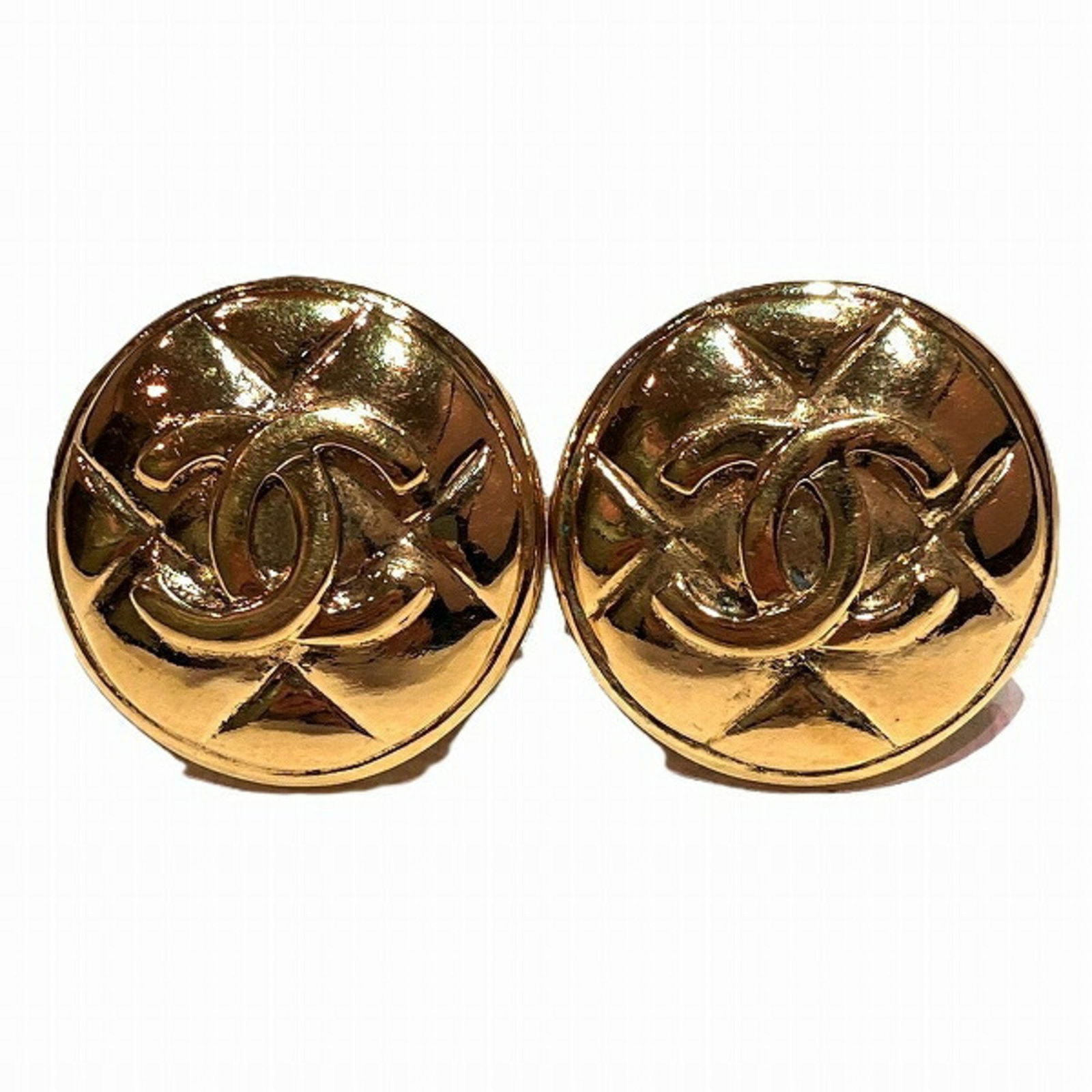 Chanel Gold Clip Earrings for Women: Chanel Gold Clip Earrings for Women Elevate your accessory collection with these exquisite Chanel Coco Mark Gold Accessory Earrings. Designed for women, these clip earrings feature a stunning gold col