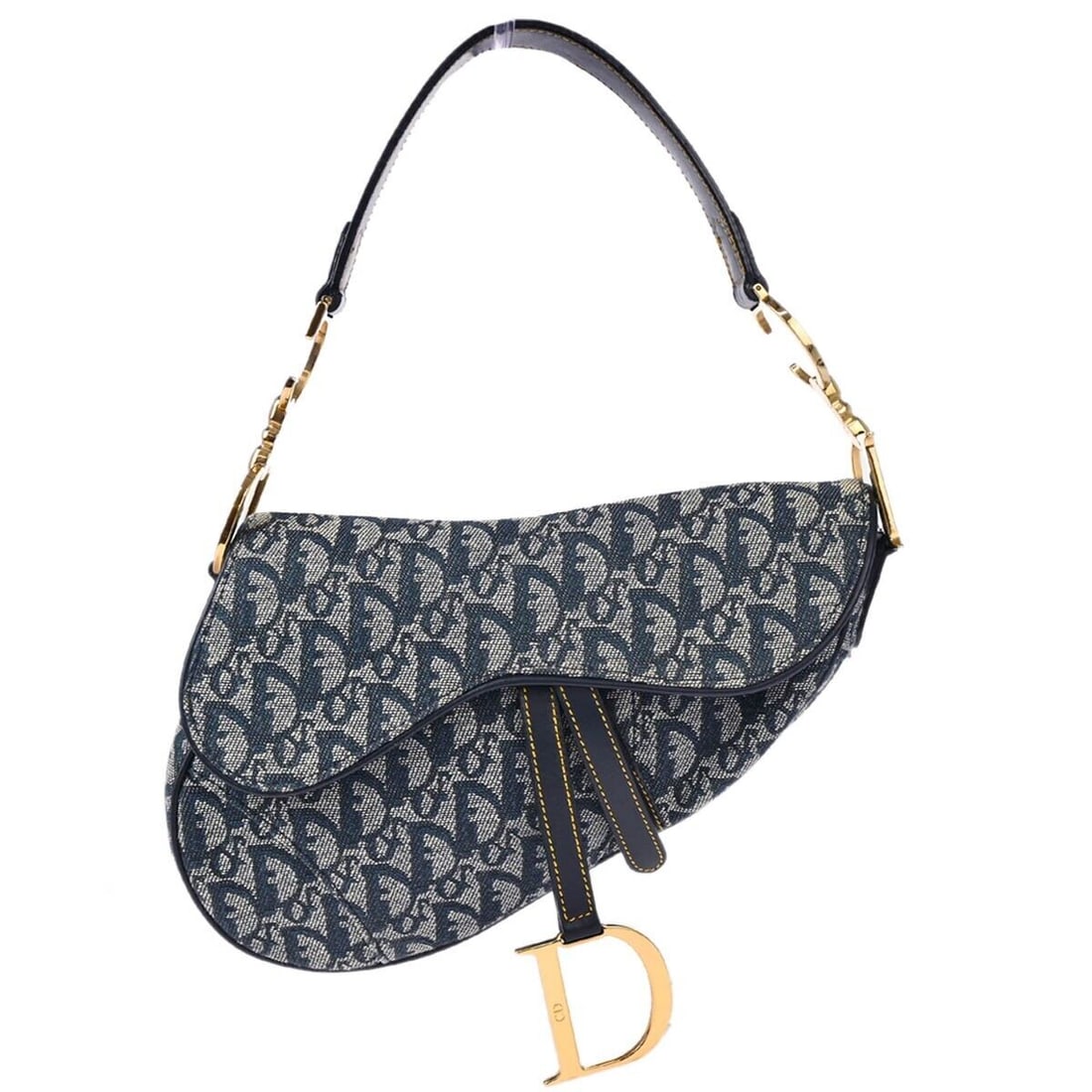 Christian Dior Navy Saddle Bag: Christian Dior Navy Saddle Bag The Christian Dior Navy Trotter Saddle Handbag showcases a distinctive saddle bag design in a chic navy color. This medium-sized handbag is crafted from durable canvas l