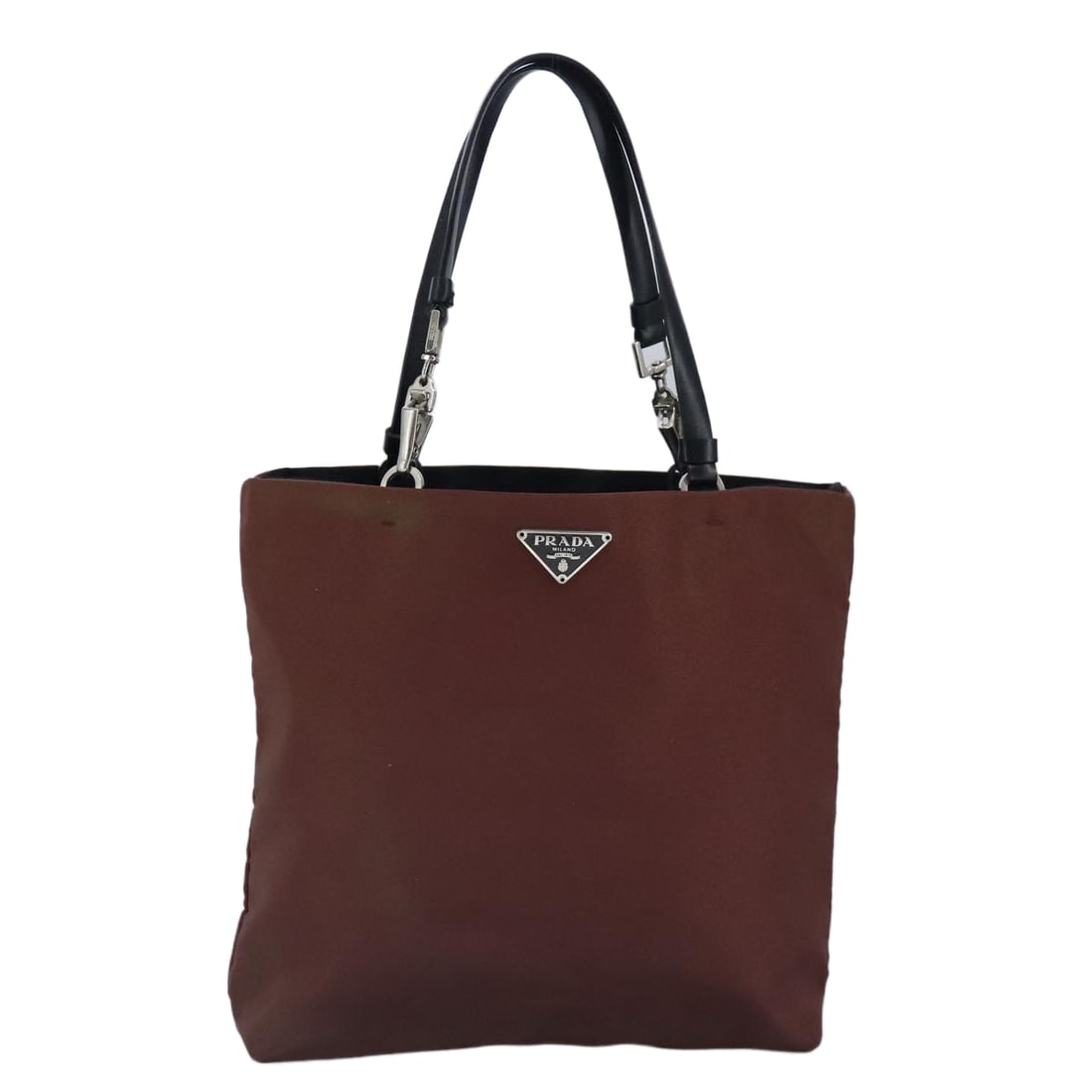 Prada Triangle Logo Synthetic Brown Bag: Prada Triangle Logo Synthetic Brown Bag Introducing the Prada Triangle Logo tote bag, a stylish accessory perfect for everyday use. This elegant brown bag features black handles and is crafted from du