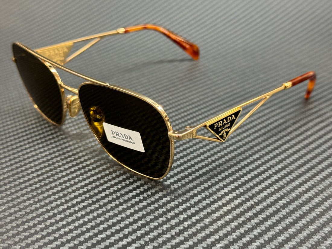 Gold PRADA Women's Sunglasses 59 mm: Gold PRADA Women's Sunglasses 59 mm Stylish and sophisticated, these PRADA sunglasses feature a stunning gold frame that complements any outfit. The geometric frame design adds a modern touch, while t