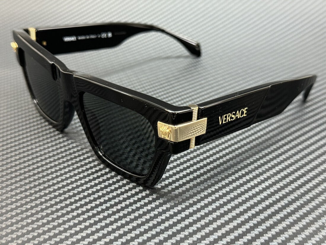 Versace Black Grey Men's Sunglasses: Versace Black Grey Men's Sunglasses Elevate your style with these Versace VE4464 sunglasses, featuring a classic black frame complemented by striking gold accents. Designed specifically for men, these