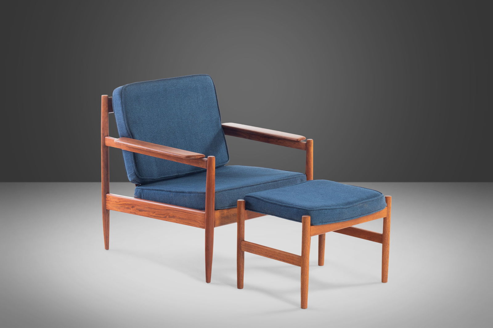 Mid-Century Modern Teak Lounge Chair & Ottoman in Navy Knit, c. 1960s: Mid-Century Modern Teak Lounge Chair & Ottoman in Navy Knit, c. 1960s This elegant Lounge Chair and Ottoman, attributed to Arne Vodder, showcases a beautiful teak construction with a striking angular