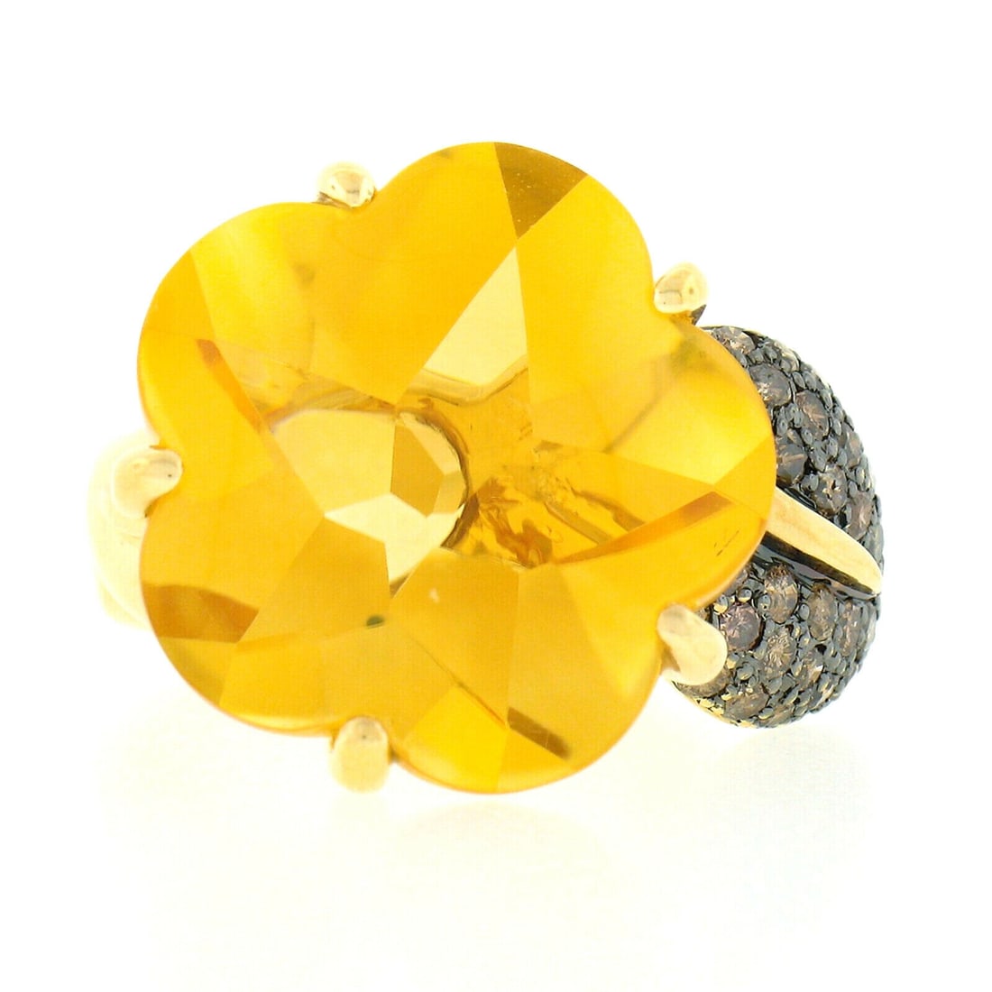 18K Yellow Gold Flower Cocktail Ring with Citrine & Fancy Brown Diamonds: 18K Yellow Gold Flower Cocktail Ring with Citrine & Fancy Brown Diamonds This stunning cocktail ring is crafted from solid 18K yellow gold and features a unique flower design adorned with a vibrant na