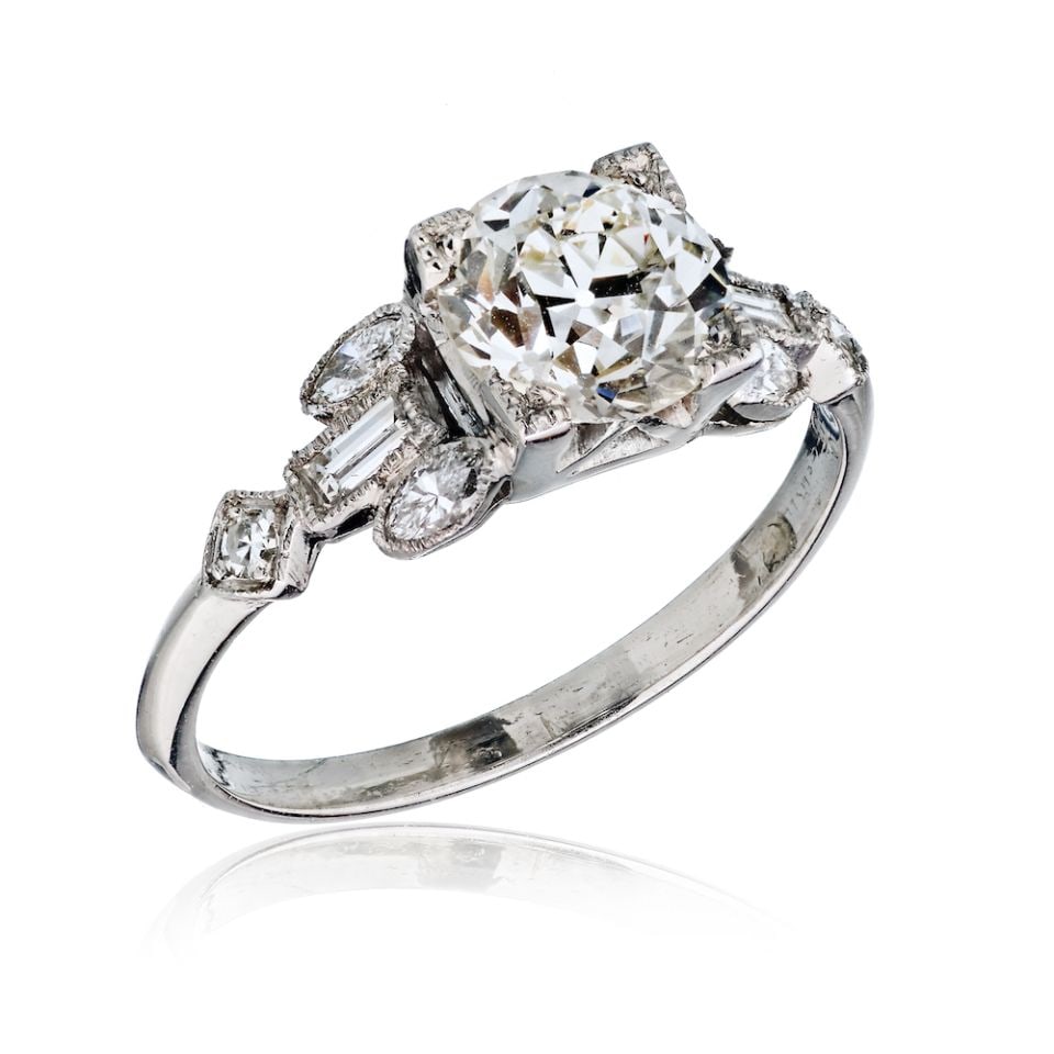 Ring: 1.54 Carat Old European Cut Diamond Vintage Engagement Ring Size 7 This exquisite engagement ring is crafted from high-quality platinum and features a stunning 1.54 carat Old European Cut diamond, gra