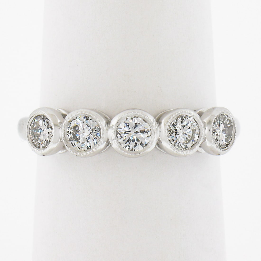 NEW Platinum 0.68ctw Milgrain Bezel Round Diamond 5 Stone Stack Wedding Band Ring: NEW Platinum 0.68ctw Milgrain Bezel Round Diamond 5 Stone Stack Wedding Band Ring This exquisite platinum wedding band features a stunning array of five round diamonds, totaling 0.68 carats, elegantly