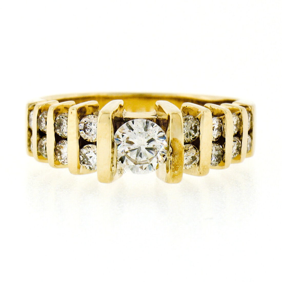 14K Yellow Gold .75ct Tension Set Diamond Engagement Ring 6.5: 14K Yellow Gold .75ct Tension Set Diamond Engagement Ring 6.5 This exquisite estate engagement ring is crafted from solid 14K yellow gold and showcases a stunning tension set round brilliant cut diamo