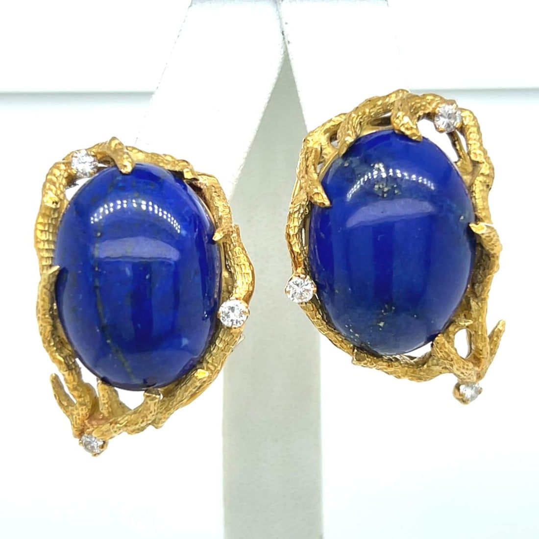 Stunning 18K Yellow Gold Lapis Lazuli Diamond Earrings 1.25": Stunning 18K Yellow Gold Lapis Lazuli Diamond Earrings 1.25" These stunning 18K Yellow Gold earrings showcase large oval lapis lazuli stones, beautifully accented with six sparkling diamonds. The diam