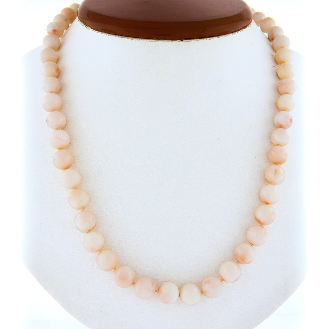 Vintage 16.5" Angel Skin Coral Necklace 14k Gold Clasp 50 Beads: Vintage 16.5" Angel Skin Coral Necklace 14k Gold Clasp 50 Beads This exquisite vintage necklace showcases a stunning strand of angel skin coral beads, each measuring approximately 8.5 mm in diameter.