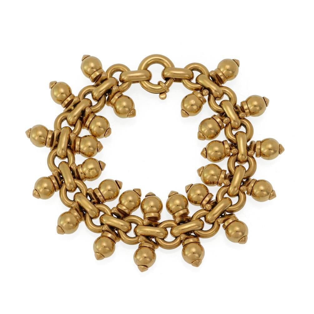 Beaded Bracelet 18k Yellow Gold 7.5" 75.8g: Beaded Bracelet 18k Yellow Gold 7.5" 75.8g This exquisite Shaking Bead Charms Bracelet is crafted from 18k yellow gold, showcasing a stylish beaded design. The bracelet features a large chain made of