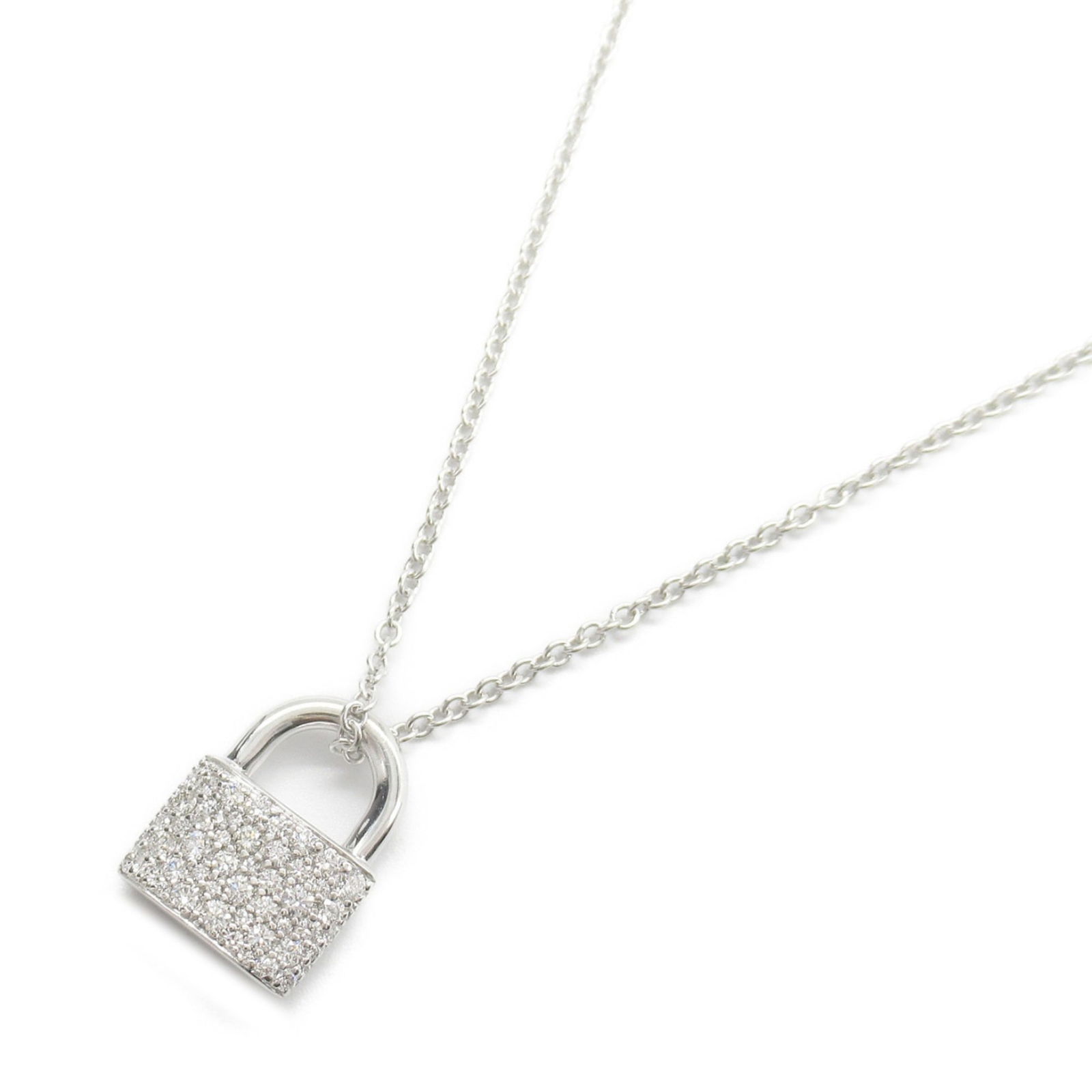 Tiffany & Co. 18K White Gold Diamond Lock Necklace 15mm x 11mm: Tiffany & Co. 18K White Gold Diamond Lock Necklace 15mm x 11mm This exquisite Tiffany & Co. Hardware Lock Pave Diamond Necklace is crafted from 18K white gold and elegantly adorned with clear diamonds