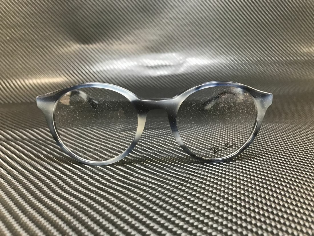 Ray Ban RX5361 5773 Beige Horn Grey Blue 49mm Unisex Eyeglasses: Ray Ban RX5361 5773 Beige Horn Grey Blue 49mm Unisex Eyeglasses Discover the stylish RAY BAN RX5361 5773 Horn Grey/Blue Phantos eyeglasses, designed for unisex wear. Featuring a contemporary phantos s