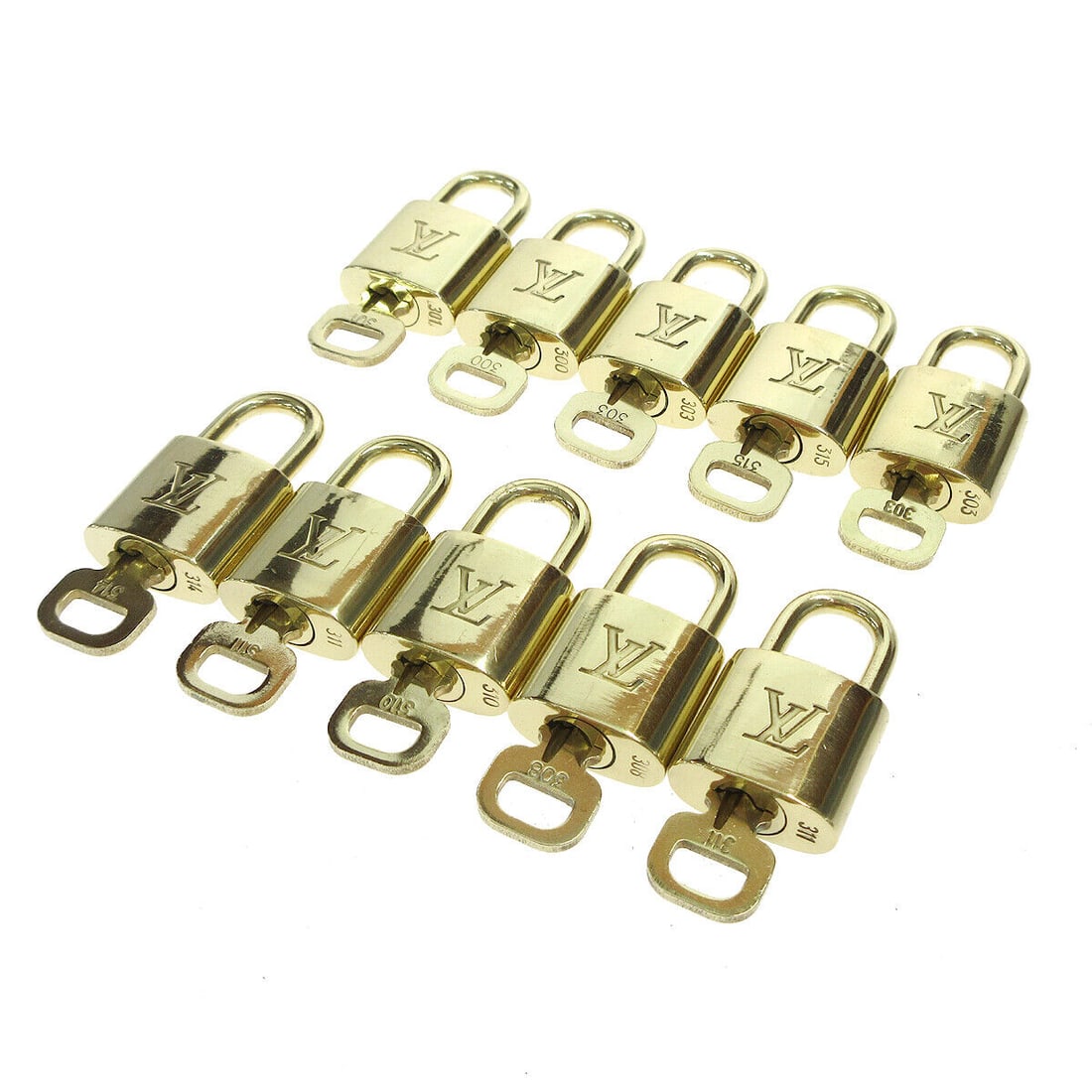 LOUIS VUITTON Gold Padlock & Key 10 Piece Bag Charm Set: LOUIS VUITTON Gold Padlock & Key 10 Piece Bag Charm Set Enhance your luxury collection with this exquisite LOUIS VUITTON Padlock & Key Bag Accessories Charm Set. Featuring a stunning gold color, this 