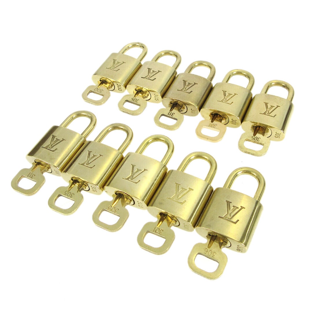 Louis Vuitton Gold Padlock & Key Bag Accessories 10-Piece Set: Louis Vuitton Gold Padlock & Key Bag Accessories 10-Piece Set Enhance your collection with this elegant 10-piece set of Louis Vuitton Padlock & Key Bag Accessories. Crafted in a luxurious gold tone, t