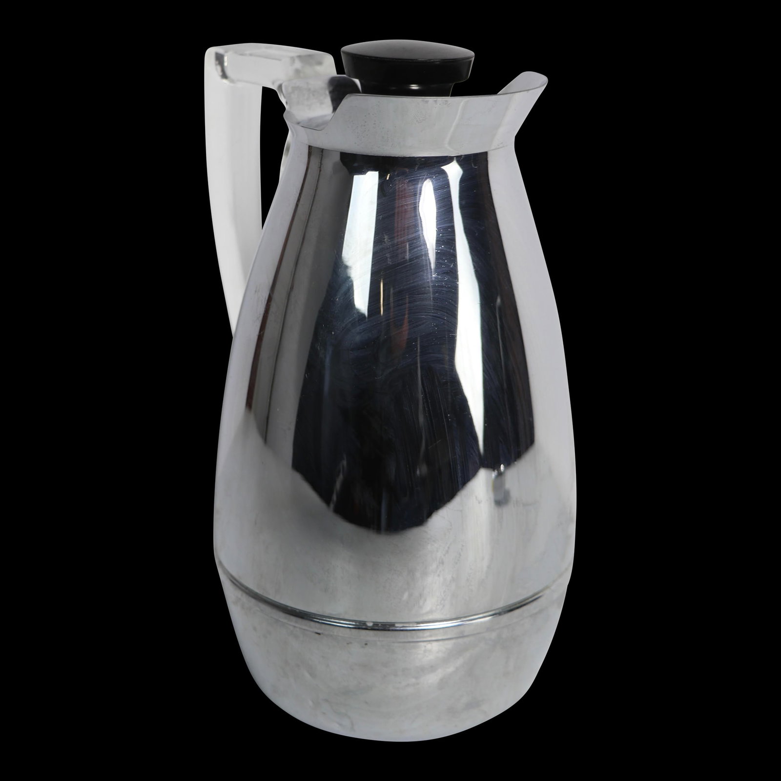 Thermos Modern Chrome and Lucite Decanter 5 x 5.5 x 9: Thermos Modern Chrome and Lucite Decanter 5 x 5.5 x 9 This stylish Chrome and Lucite Decanter by Thermos features a sleek chrome body complemented by a transparent lucite handle and a black plastic ca