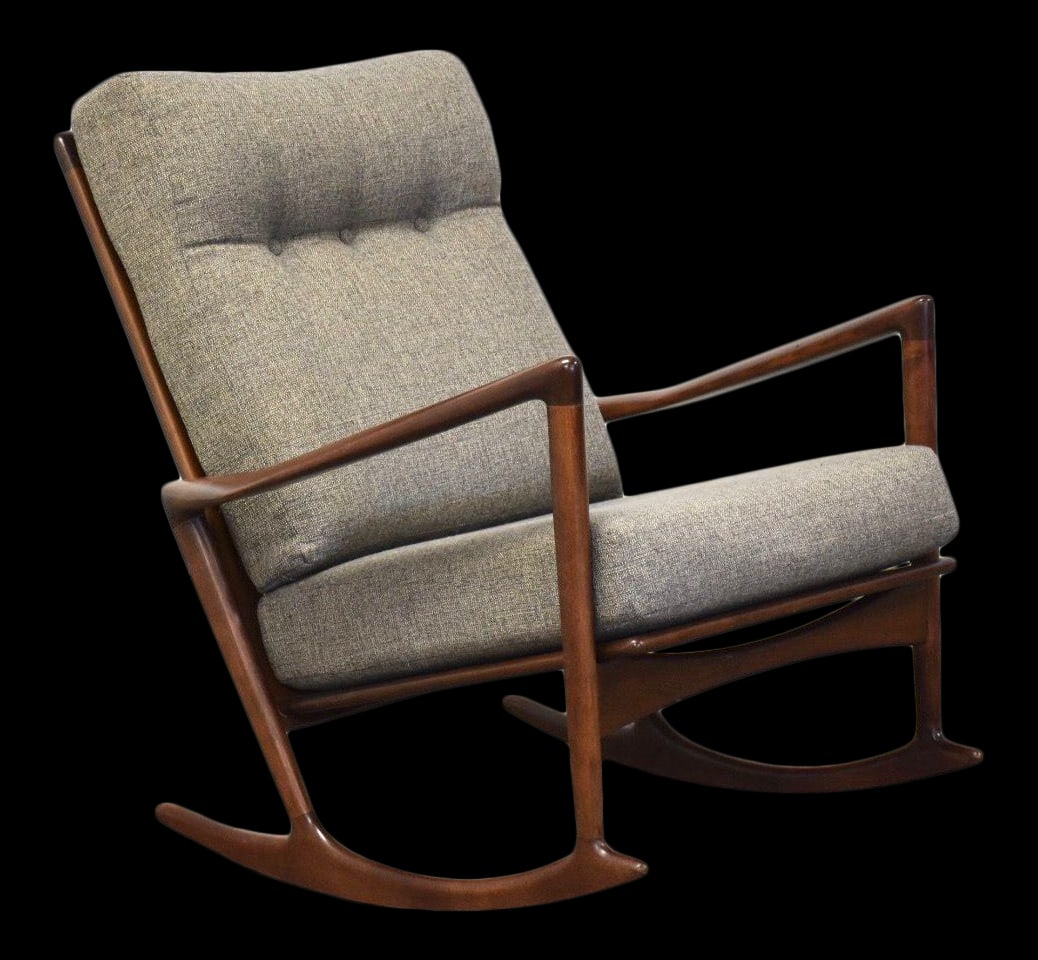 Ib Kofod Larsen Mid-Century Walnut Rocking Chair with Gray Upholstery: Ib Kofod Larsen Mid-Century Walnut Rocking Chair with Gray Upholstery This mid-century modern rocking chair, designed by Ib Kofod Larsen for Selig, features a striking walnut finish complemented by st
