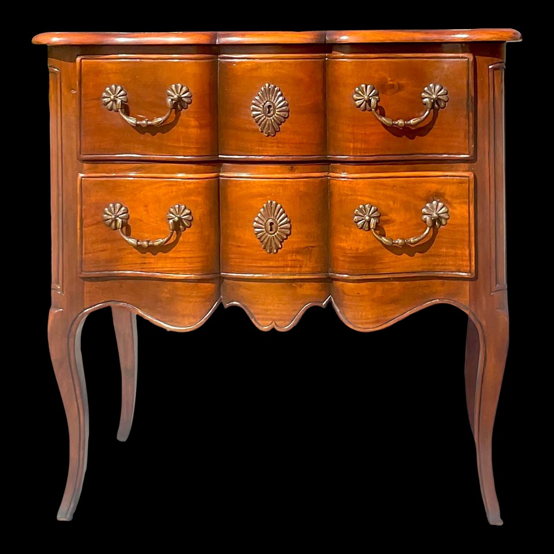 Vintage Regency Wave Front Wooden Chest of Drawers in Cinnamon 31.5": Vintage Regency Wave Front Wooden Chest of Drawers in Cinnamon 31.5" A fantastic vintage Regency chest of drawers. A beautiful wave front design with heavy brass hardware. Acquired from a Palm Beach e