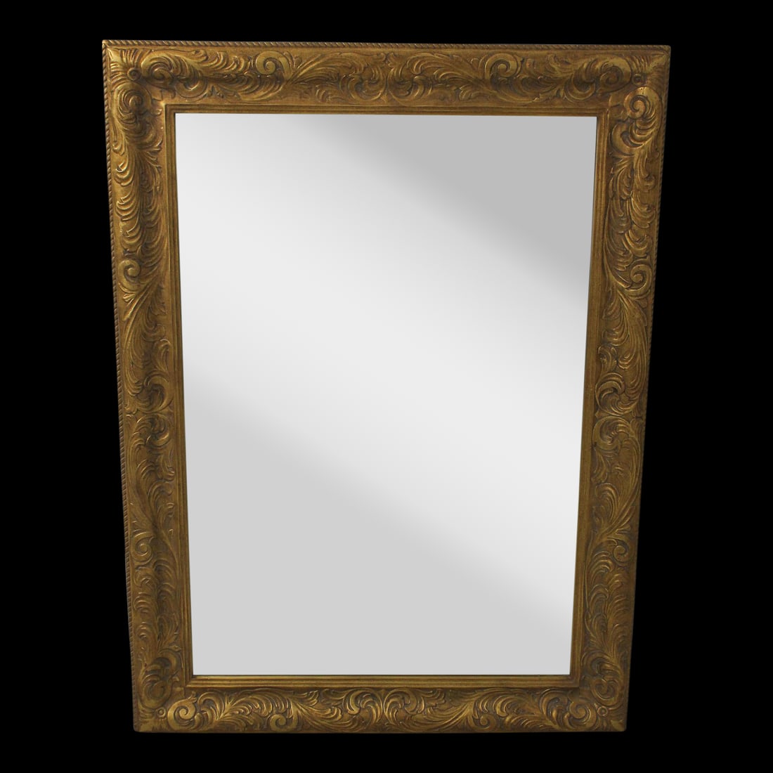 Ornate Carved Gold Gilt Mirror 36"W x 48"H Neoclassical Design: Ornate Carved Gold Gilt Mirror 36"W x 48"H Neoclassical Design This stunning rectangular mirror features an ornate carved frame with a gold gilt finish and red undertones, embodying a neoclassical des