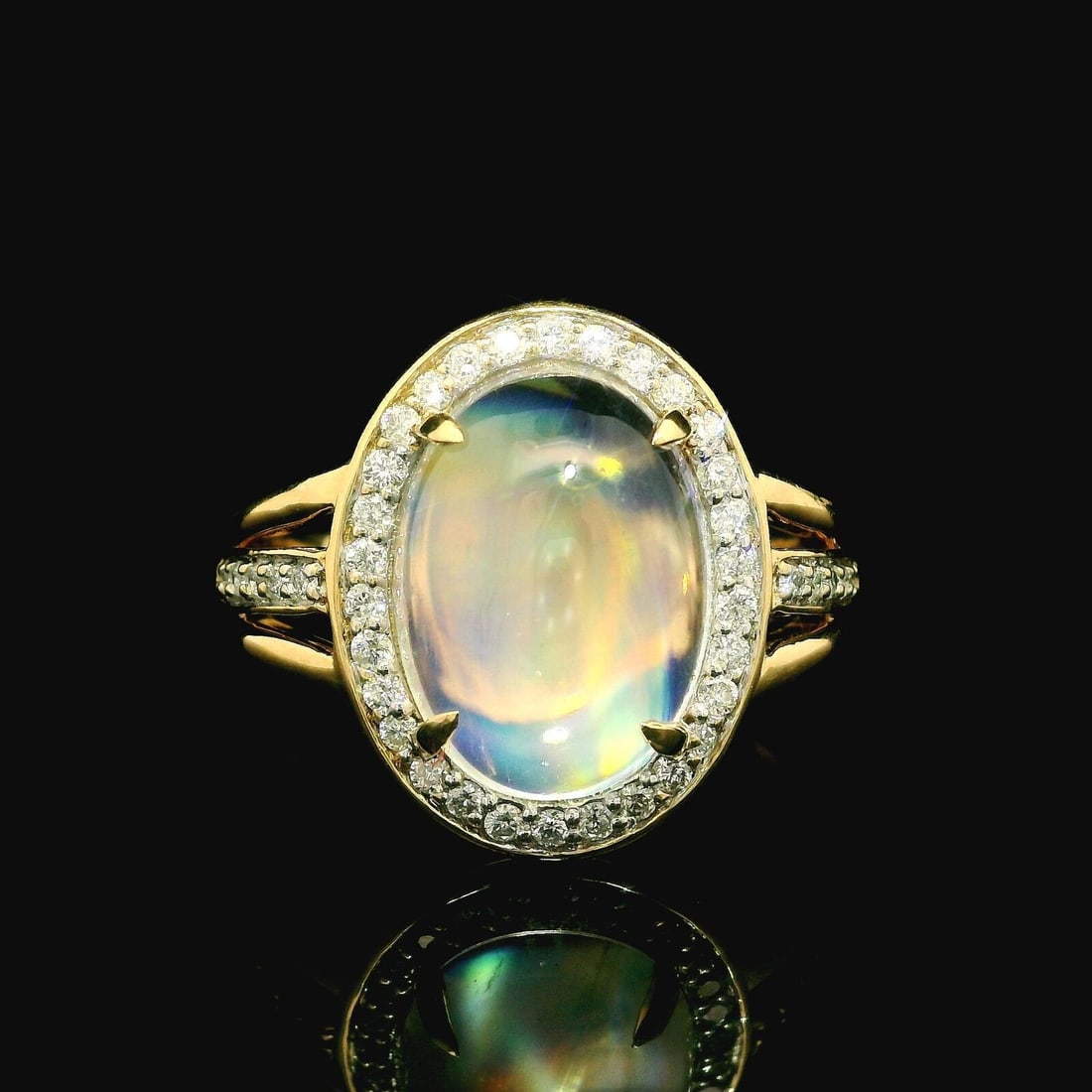 14k Yellow Gold Rainbow Moonstone Diamond Cocktail Ring Size 10: 14k Yellow Gold Rainbow Moonstone Diamond Cocktail Ring Size 10 This stunning cocktail ring features a captivating oval cabochon of natural rainbow moonstone, measuring approximately 13.7x10mm, prong 