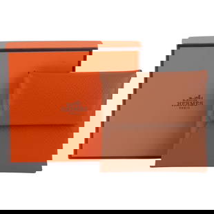 Hermes Gold Epsom Leather Coin Case 3.25 in France: Hermes Gold Epsom Leather Coin Case 3.25 in France This exquisite coin case from Hermes is crafted from luxurious gold Epsom leather, showcasing a refined and elegant design. The wallet features palla