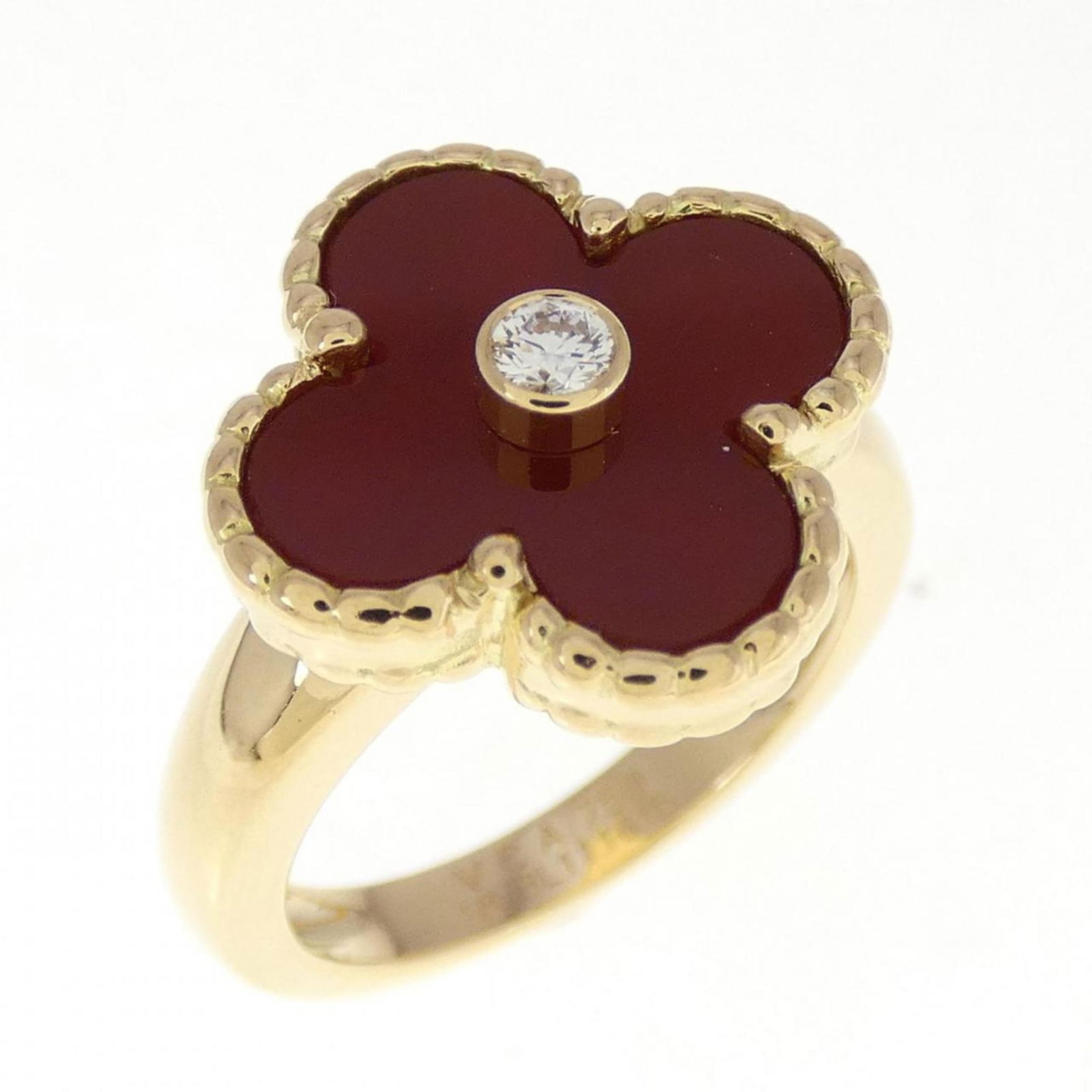 Van Cleef & Arpels Vintage Alhambra Ring: Van Cleef & Arpels Vintage Alhambra Ring Brand: Van Cleef & Arpels Type: Band ring Gender: Women Material: Yellow gold (18K) Stone: Carnelian, Diamond Brand Size (Non US): 48 US Size: 4.5 Overall Scra