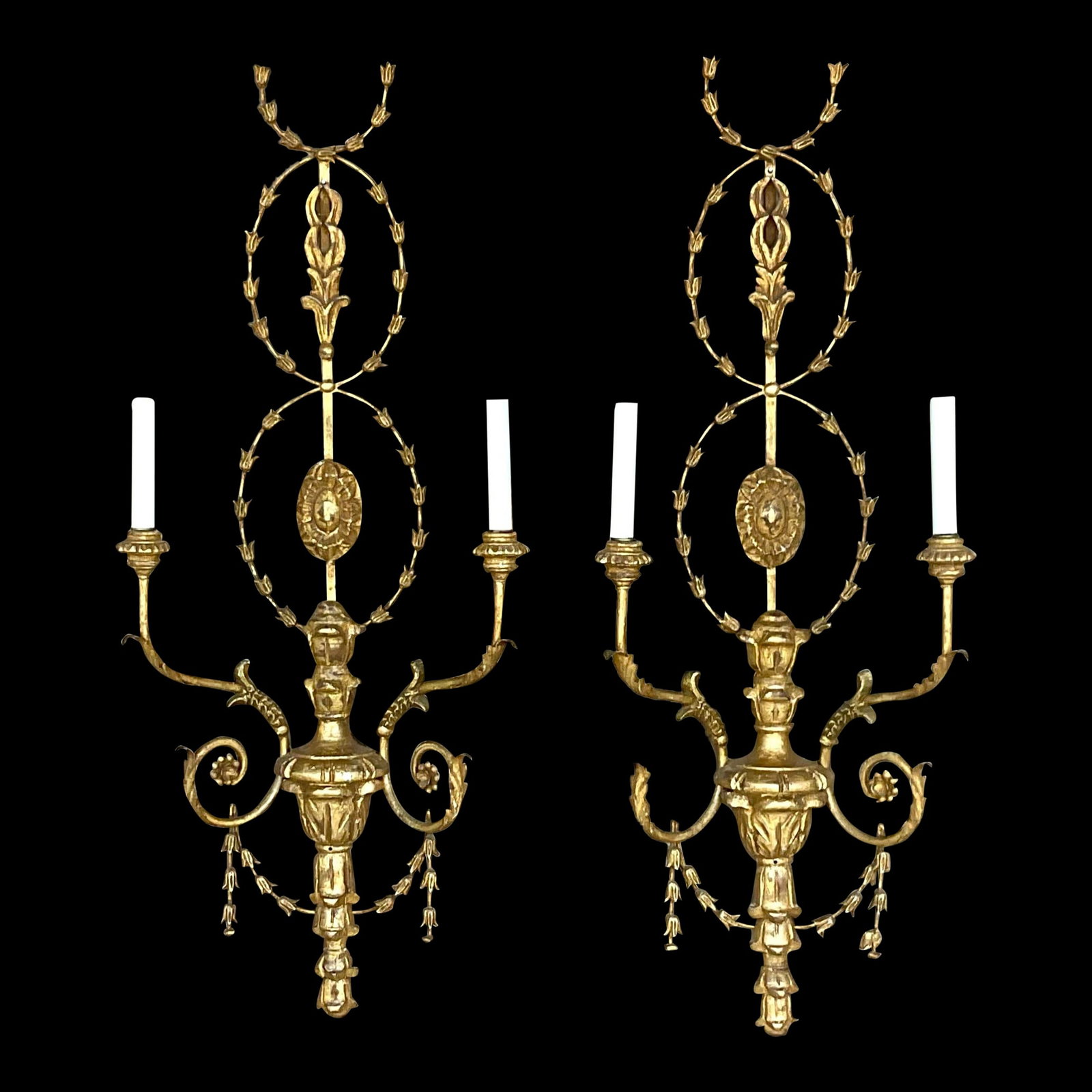 Pair of Vintage Regency Gilt Wood Garland Wall Sconces: Pair of Vintage Regency Gilt Wood Garland Wall Sconces A fantastic pair of vintage Regency wall sconces. Chic gesso over carved wood in a wrapping garland design. Bright gilt finish. Acquired from a P