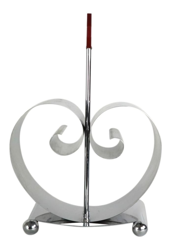 1930s Bel Geddes Art Deco Chrome Bakelite Magazine Stand 17.5": 1930s Bel Geddes Art Deco Chrome Bakelite Magazine Stand 17.5" Elevate your space with this elegant Art Deco magazine stand designed by Norman Bel Geddes for Revere. This striking piece features a bri