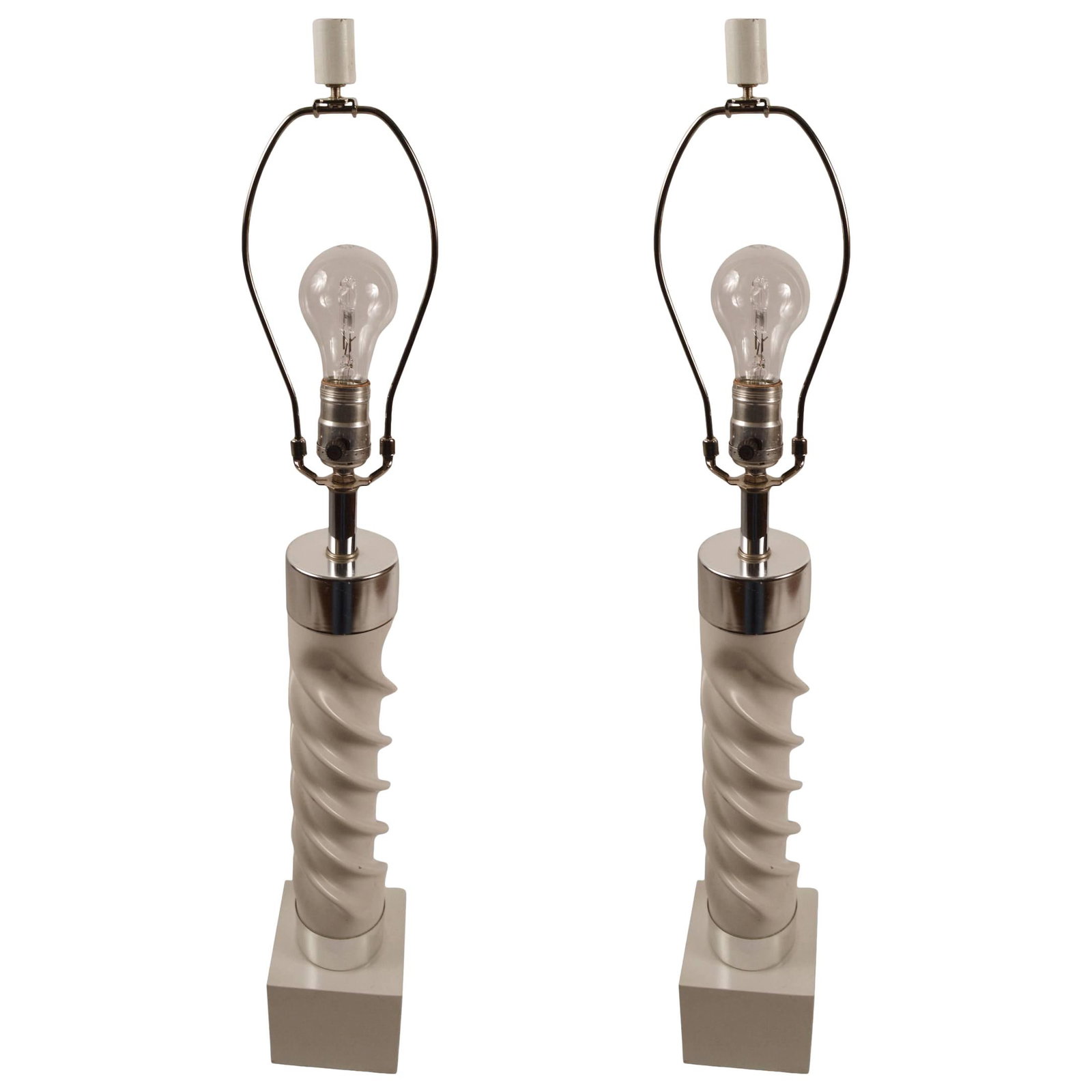 Stylish White Chrome Twist Lamps 32.5 Height Pair: Stylish White Chrome Twist Lamps 32.5 Height Pair Twist columns mounted on cube block bases, with chrome collars. These lamps show minor cosmetic wear, normal and consistent with age. Working, origina