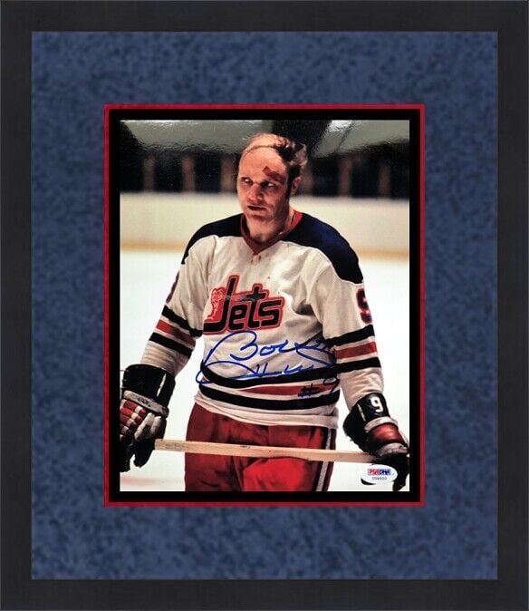 Bobby Hull Signed 8x10 Photo Custom Framed with PSA/DNA COA: Bobby Hull Signed 8x10 Photo Custom Framed with PSA/DNA COA This stunning 8" x 10" color photograph captures the iconic Bobby Hull in a dynamic moment. It features his authentic signature, certified b