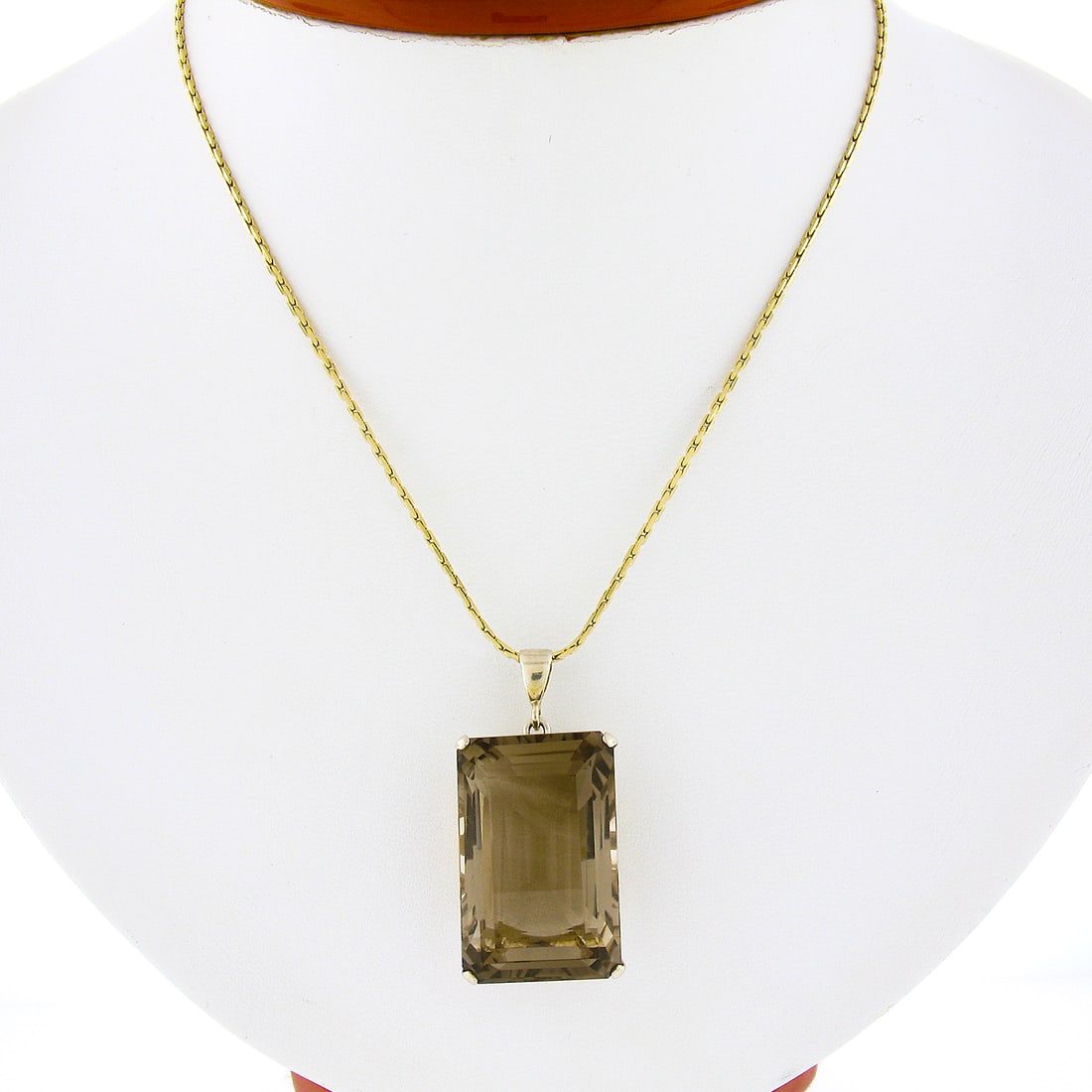 Vintage 10K Yellow Gold 35ct Emerald Cut Smoky Quartz Pendant with 14K Chain: Vintage 10K Yellow Gold 35ct Emerald Cut Smoky Quartz Pendant with 14K Chain This stunning vintage pendant is crafted from solid 10K yellow gold and features a remarkable 35+ carat natural smoky quart