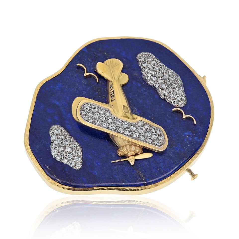 David Webb Platinum 18K Yellow Gold Lapis Diamond Airplane Brooch: David Webb Platinum 18K Yellow Gold Lapis Diamond Airplane Brooch This exquisite brooch by David Webb features a stunning airplane design crafted from a combination of platinum and 18K yellow gold. Ad