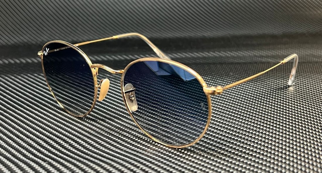 Ray-Ban RB3447N 001 3F Gold Frame Blue Gradient Round Sunglasses 53mm: Ray-Ban RB3447N 001 3F Gold Frame Blue Gradient Round Sunglasses 53mm Elevate your style with the Ray-Ban RB3447N 001 3F sunglasses, featuring a stunning gold frame and blue gradient lenses. Designed