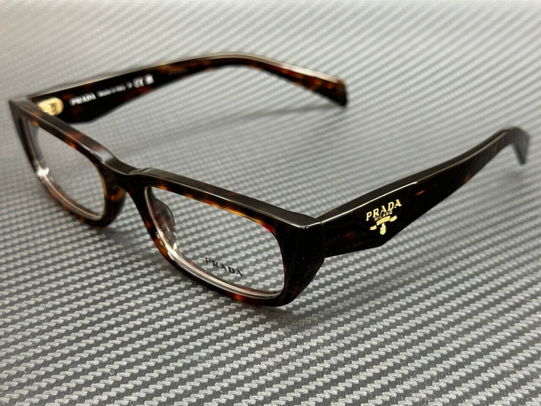 PRADA PR B05V 17N1O1 Women's Root Tortoise Eyeglasses 54mm: PRADA PR B05V 17N1O1 Women's Root Tortoise Eyeglasses 54mm Introducing the PRADA PR B05V 17N1O1 eyeglasses, designed for women with a stylish root tortoise frame color. These eyeglasses not only enhan