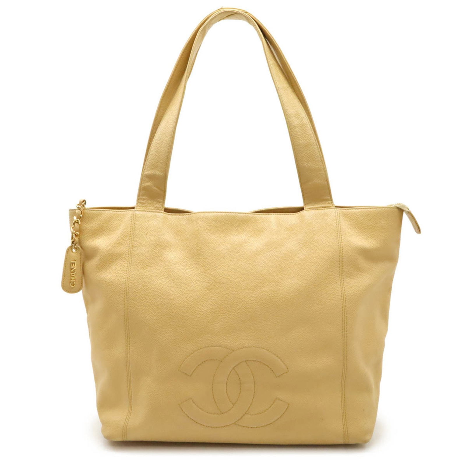 Chanel Caviar Skin Coco Mark Tote Bag Beige Yellow Shoulder Bag: Chanel Caviar Skin Coco Mark Tote Bag Beige Yellow Shoulder Bag This stunning CHANEL Coco Mark Tote Bag is crafted from luxurious caviar leather in a beautiful blend of beige and yellow tones. Designe