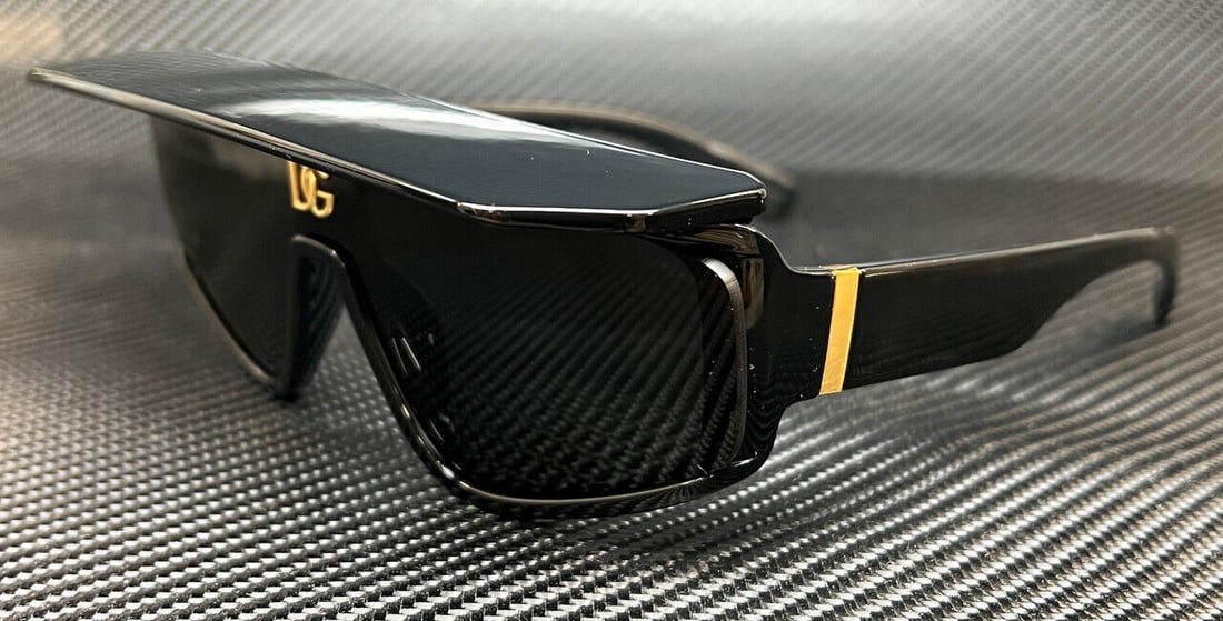 Dolce&Gabbana DG6177 501/87 Black Oversized Sunglasses UV400: Dolce&Gabbana DG6177 501/87 Black Oversized Sunglasses UV400 Elevate your style with the DOLCE & GABBANA DG6177 501 87 sunglasses. These designer classic sunglasses feature a sleek black acetate frame