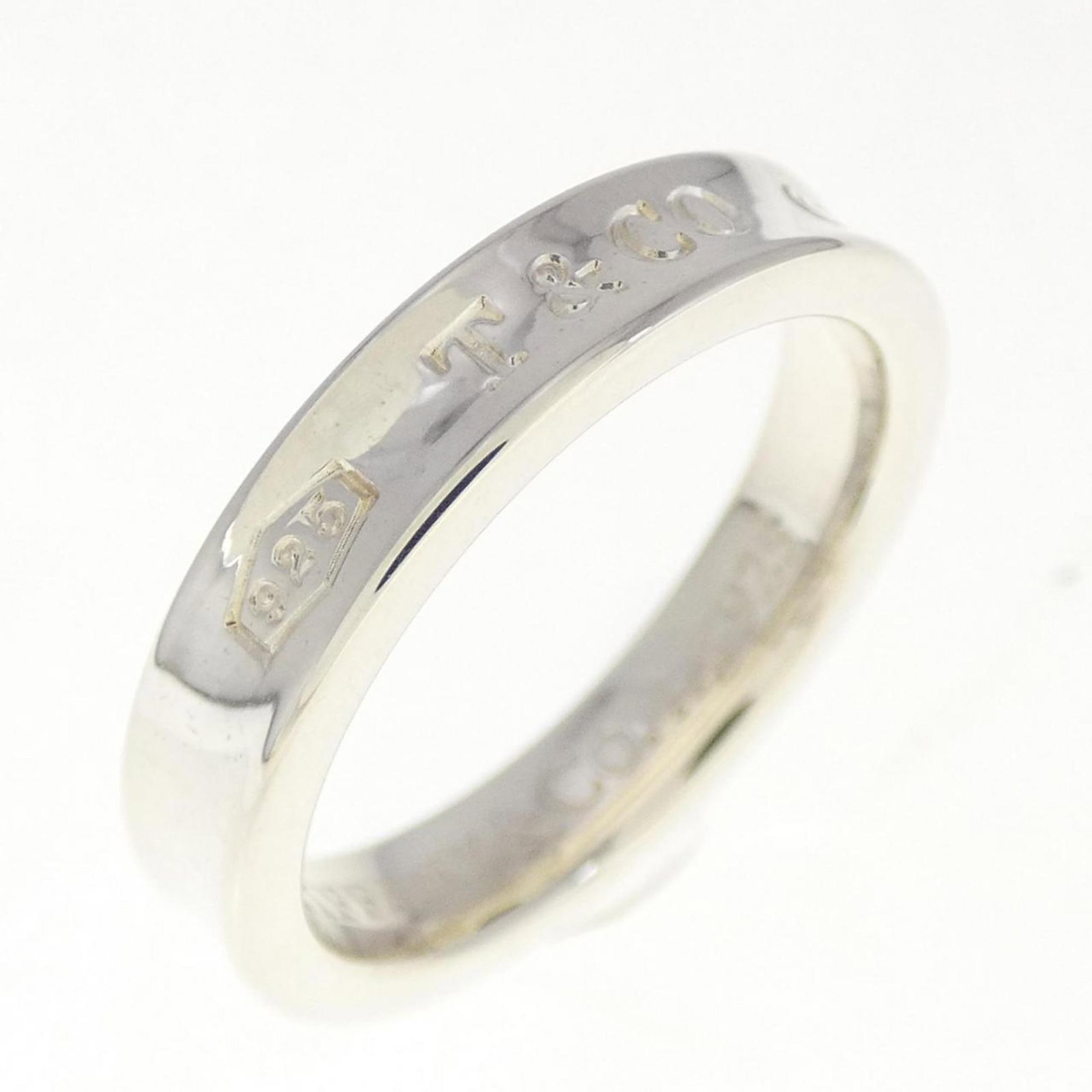 Tiffany 1837 Women's Silver 925 Narrow Band Ring Size 5.5: Tiffany 1837 Women's Silver 925 Narrow Band Ring Size 5.5 This elegant Tiffany 1837 narrow band ring is designed for women, crafted from high-quality Silver 925. The ring features a US size of 5.5 and