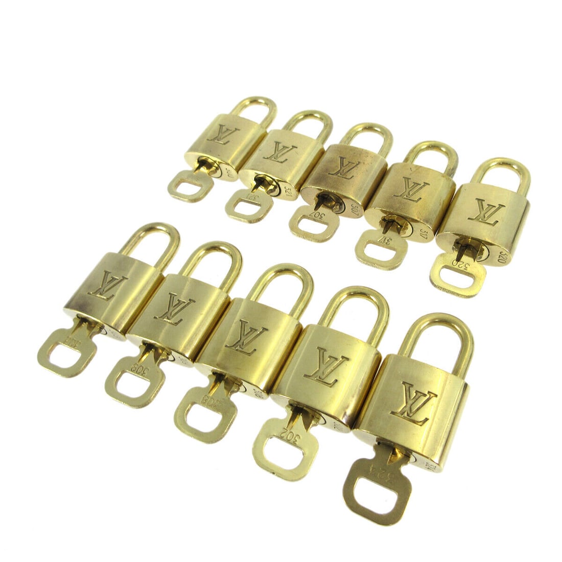LOUIS VUITTON Padlock & Key Accessories Charm 10 Piece Set Gold-tone: LOUIS VUITTON Padlock & Key Accessories Charm 10 Piece Set Gold-tone Elevate your style with this exquisite 10-piece set of Louis Vuitton Padlock & Key Bag Accessories. Crafted from durable gold-tone 