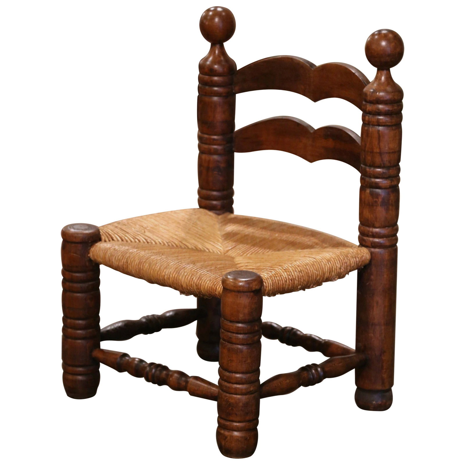 Charles Dudouyt Early 20th Century French Oak Low Fireplace Chair: Charles Dudouyt Early 20th Century French Oak Low Fireplace Chair This exquisite early 20th-century French low fireplace chair, attributed to Charles Dudouyt, embodies rustic elegance and comfort. Cra