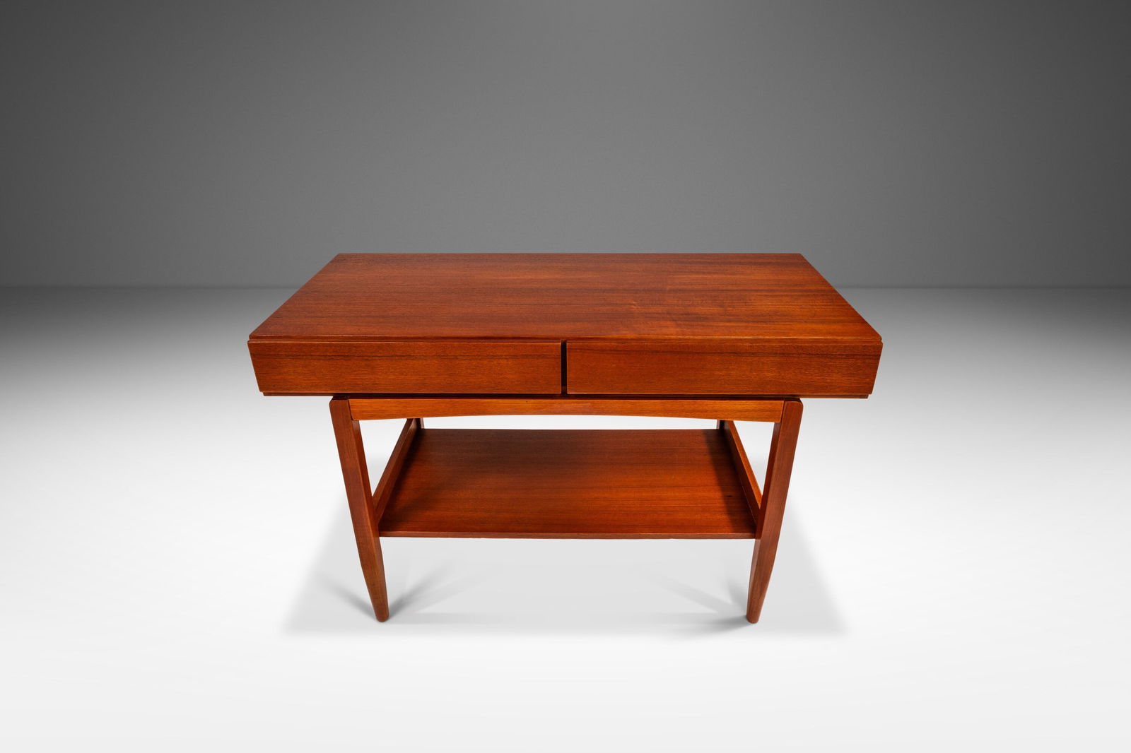 Ib Kofod Larsen Teak Console Table 45.25" Danish Modern 1960s Faarup Mobelfabrik: Ib Kofod Larsen Teak Console Table 45.25" Danish Modern 1960s Faarup Mobelfabrik Discover a stunning Danish Modern Console Table crafted from rich teak by renowned designer Ib Kofod Larsen for Faarup